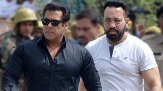 A man suddenly placed his hand on Salman Khan's shoulder; security immediately removed him, while Salman signaled his team to remain calm